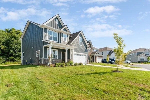 a front view of building with yard