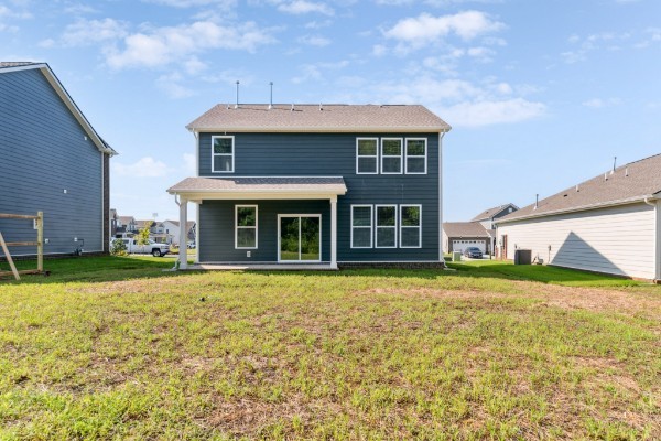 1037 Ewell Farm Drive Spring Hill, TN 37174 - Photo 23 of 31 a front view of a house with a garden