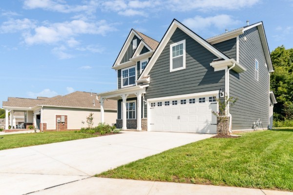 1037 Ewell Farm Drive Spring Hill, TN 37174 - Photo 3 of 31 a front view of a house with a garden and yard