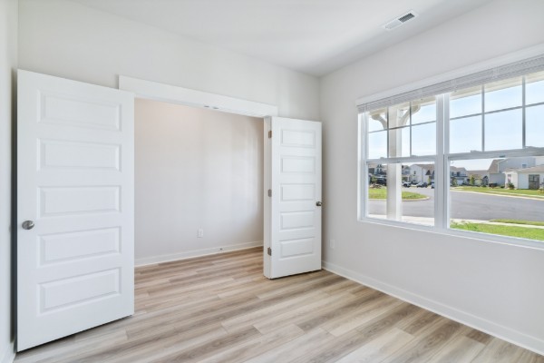 1037 Ewell Farm Drive Spring Hill, TN 37174 - Photo 4 of 31 an empty room with wooden floor and windows