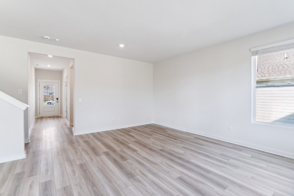 1037 Ewell Farm Drive Spring Hill, TN 37174 - Photo 6 of 31 wooden floor in an empty room with a window