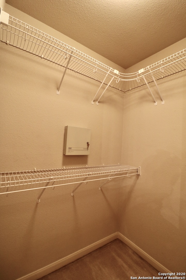 7 Claybrook San Antonio, TX 78254 - Photo 15 of 21 a view of a room with racks on the wall