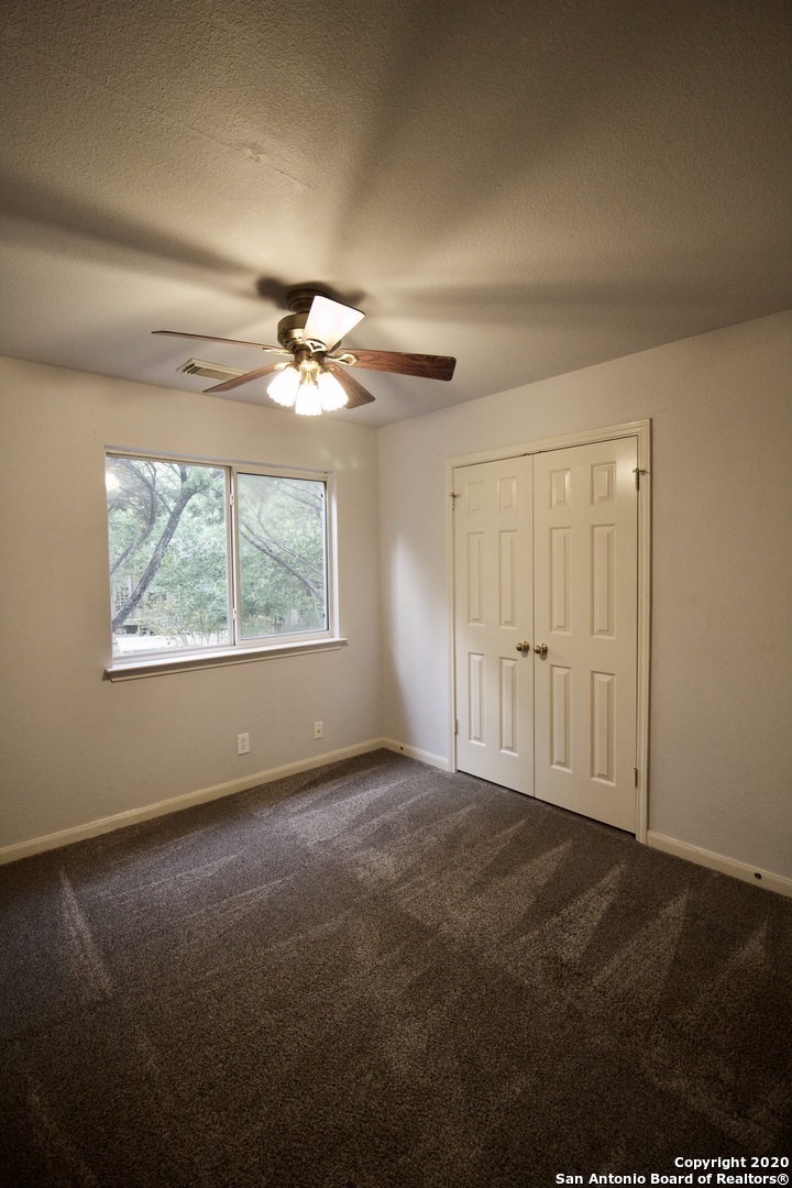 7 Claybrook San Antonio, TX 78254 - Photo 16 of 21 a view of an empty room with a window