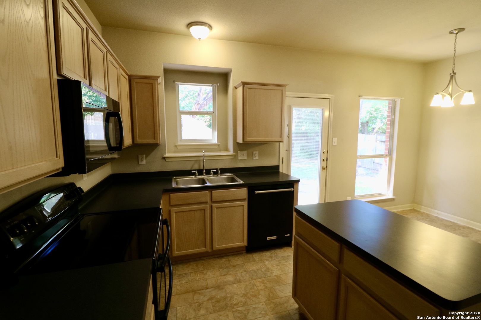7 Claybrook San Antonio, TX 78254 - Photo 2 of 21 a kitchen with a sink stove and cabinets
