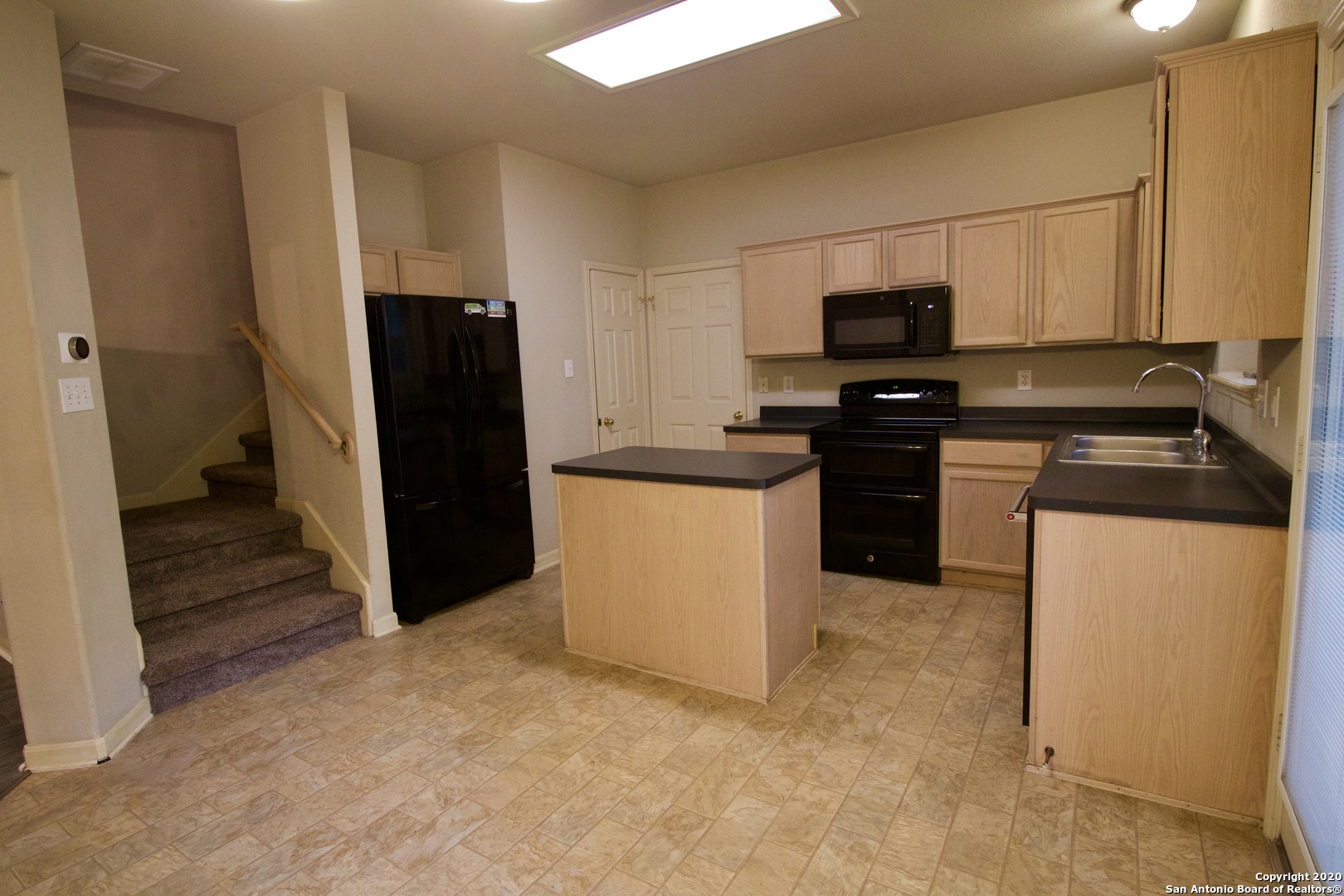 7 Claybrook San Antonio, TX 78254 - Photo 4 of 21 a kitchen with stainless steel appliances granite countertop a refrigerator stove and sink