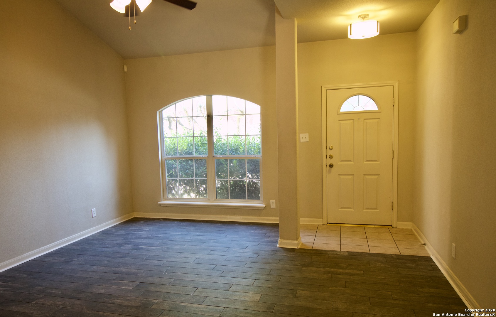 7 Claybrook San Antonio, TX 78254 - Photo 7 of 21 a view of empty room with wooden floor and fan