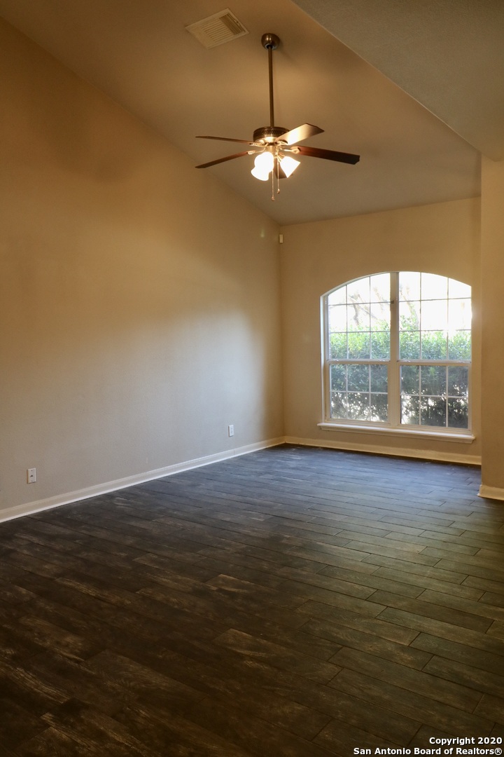 7 Claybrook San Antonio, TX 78254 - Photo 8 of 21 a view of room with window and wooden floor