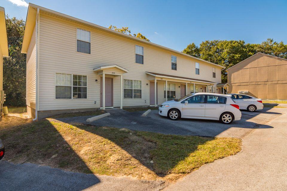 232 Runnymeade Drive Crestview, FL 32539 - Photo 1 of 11 a front view of a house with parking space