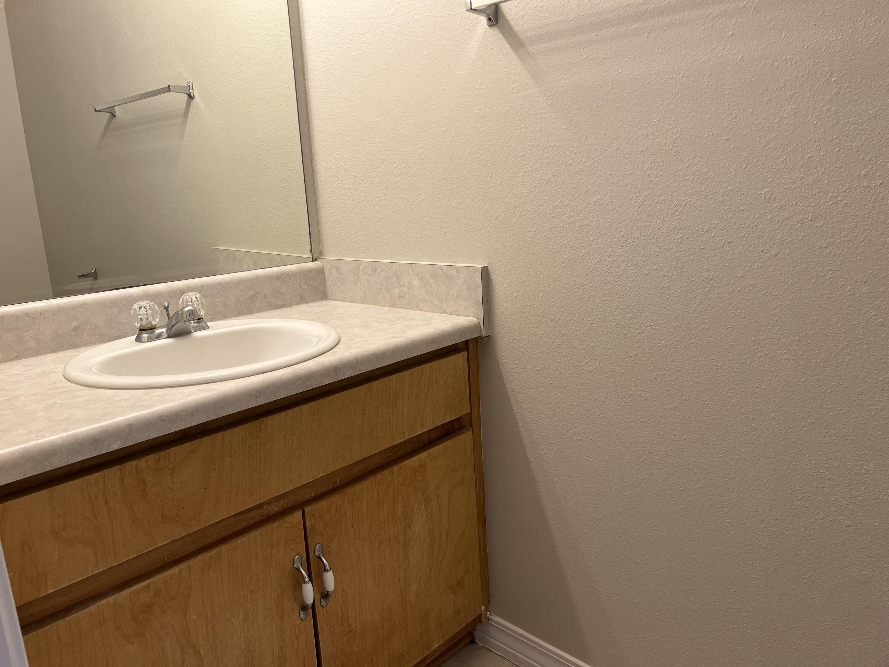 232 Runnymeade Drive Crestview, FL 32539 - Photo 5 of 11 a bathroom with a sink and a mirror
