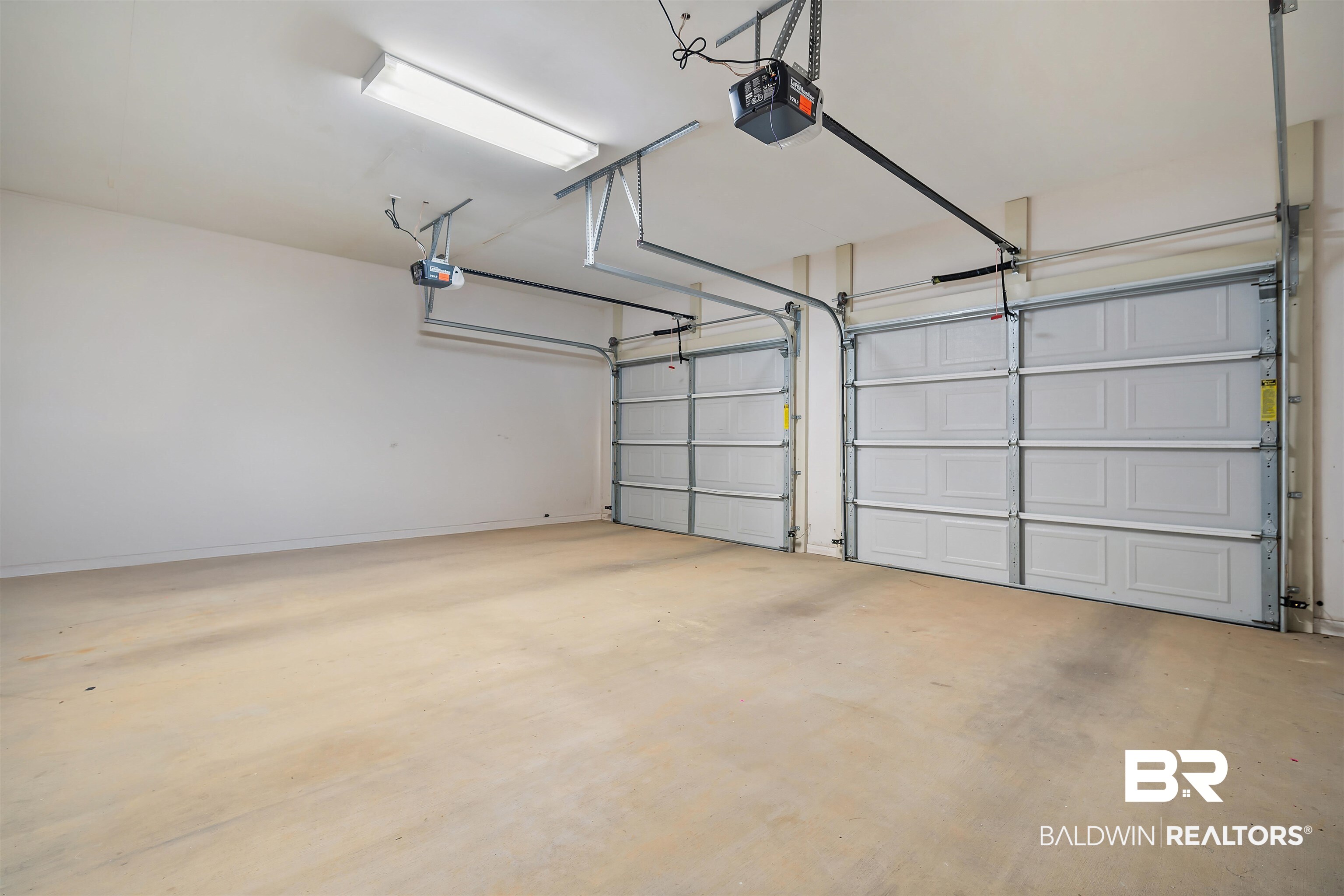7419 Pake Road Saraland, AL 36571 - Photo 23 of 27 Garage featuring a garage door opener