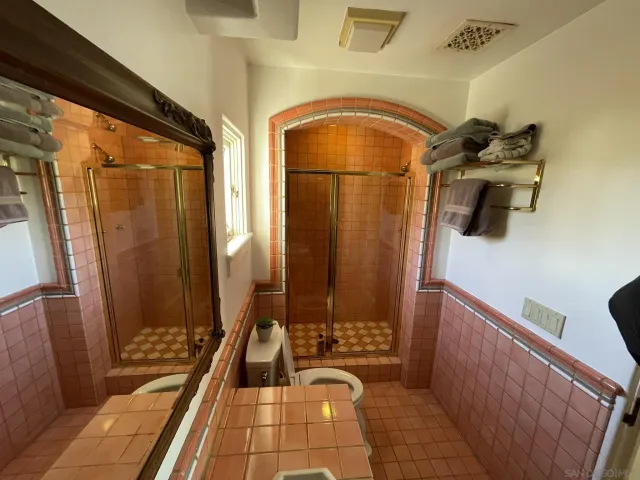 a front view of a house with plants