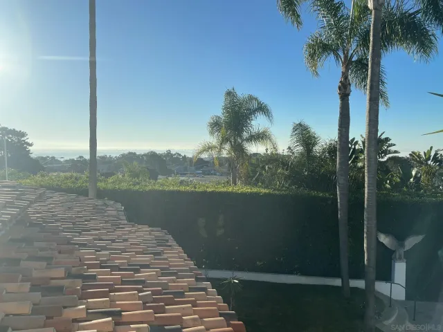 a kitchen with stainless steel appliances granite countertop a sink and a refrigerator