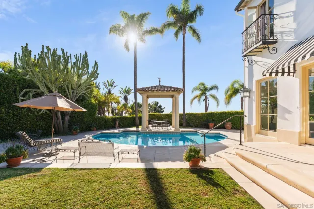 a view of a swimming pool with a patio
