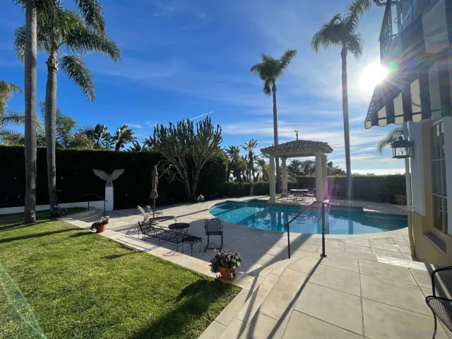 a patio with a table and chairs