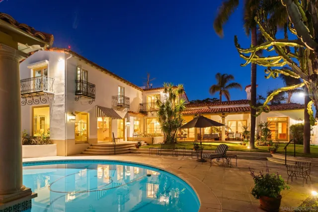 a view of a swimming pool with outdoor seating