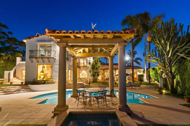 a view of a patio with table and chairs and potted plants