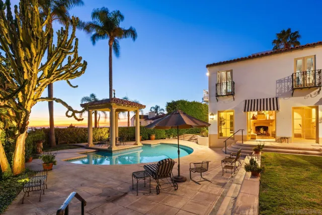 a view of a patio with swimming pool table and chairs