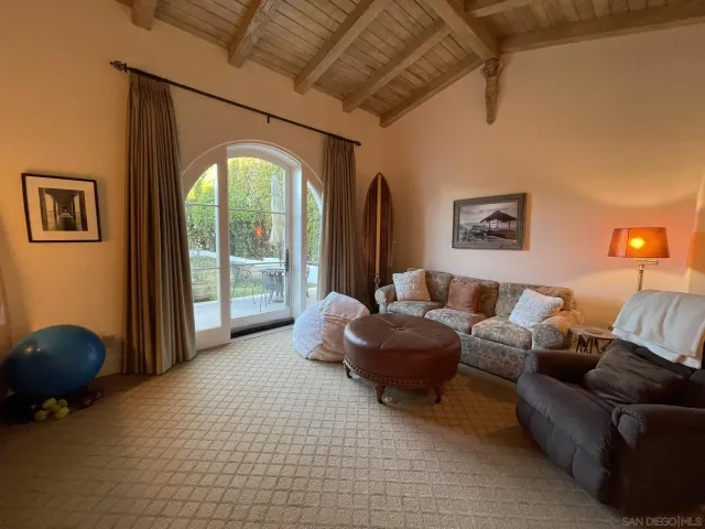 a spacious bathroom with a tub sink and mirror