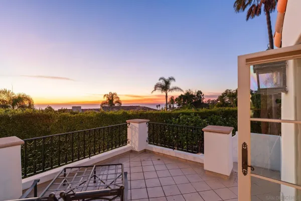 a view of a terrace with couches and sky view