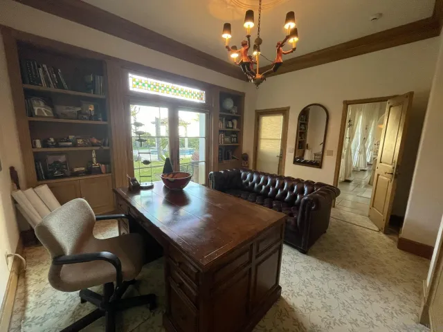 a living room with furniture a window and a fireplace