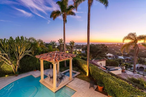 a view of a terrace with a table and chairs