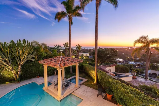 a view of a terrace with a table and chairs
