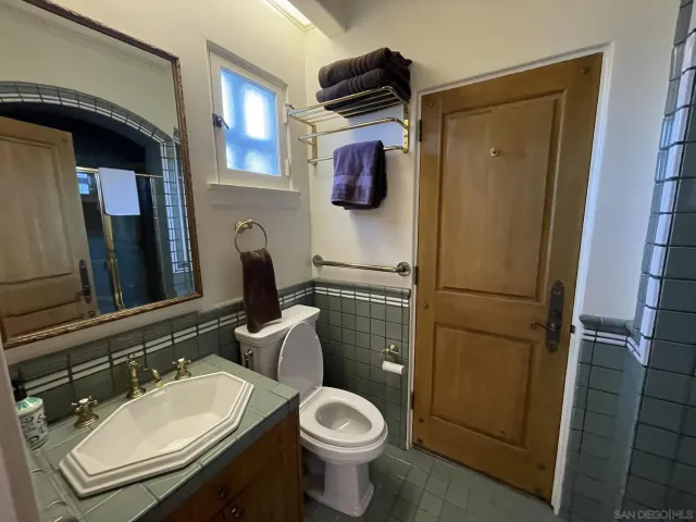 a living room with furniture a couch and a window