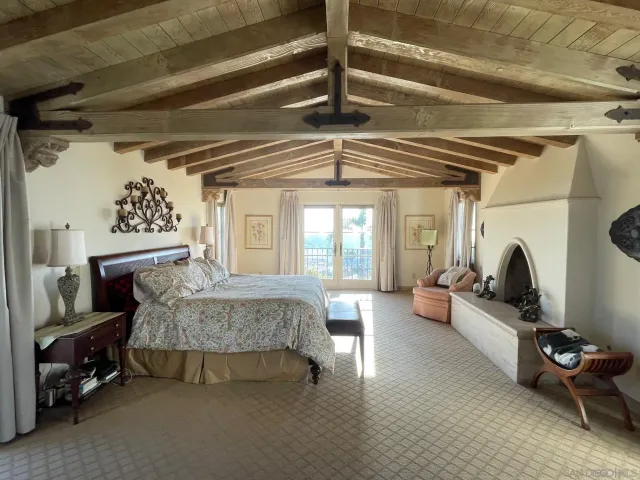 a bed room with furniture and a flat screen tv