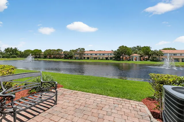 a view of a lake with a garden and outdoor space