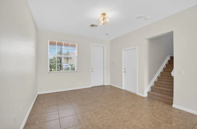 a view of an empty room with a window