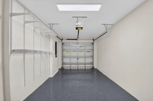 a view of a garage with shelves