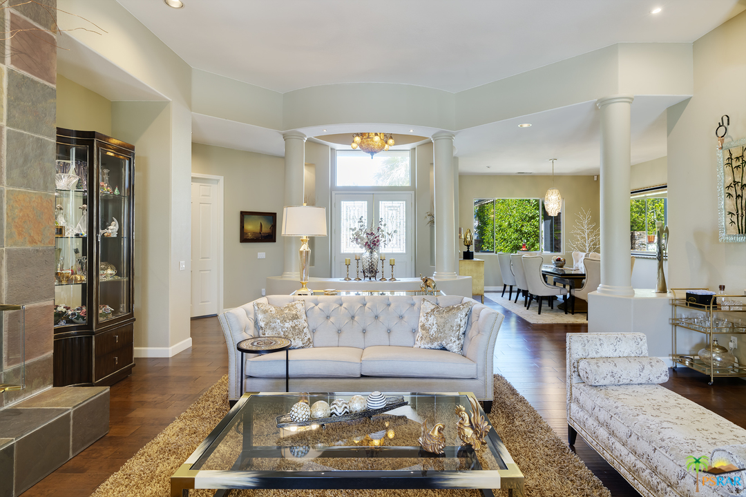19 Sherwood Road Rancho Mirage, CA 92270 - Photo 3 of 18 a living room with furniture and a large window