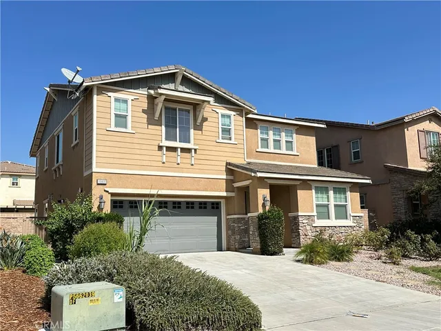 a front view of a house with yard