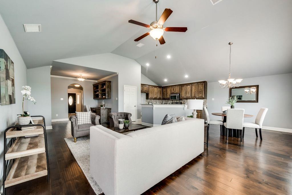 18117 Justice Lane Dallas, TX 75287 - Photo 1 of 1 a living room with furniture kitchen view and a wooden floor