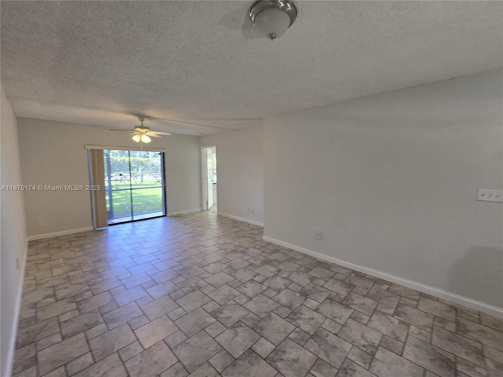 10600 Northwest 10th Street, Unit 106 Pembroke Pines, FL 33026 - Photo 2 of 17 a view of a hallway with a window