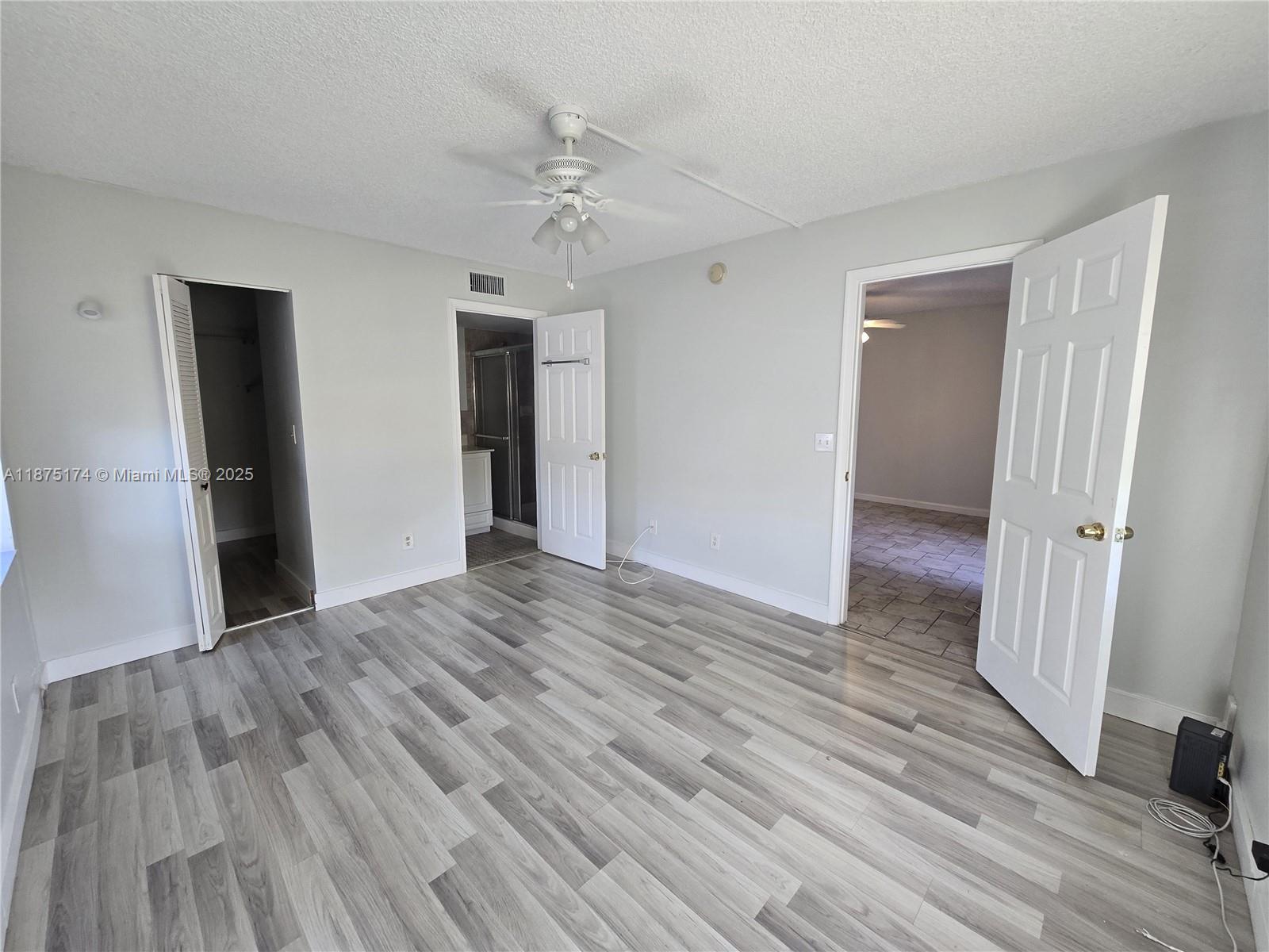 10600 Northwest 10th Street, Unit 106 Pembroke Pines, FL 33026 - Photo 9 of 17 a view of empty room with wooden floor