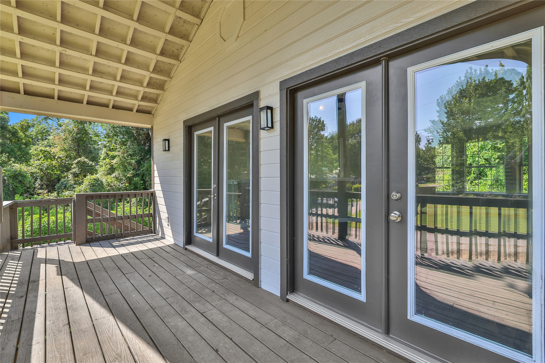 31 Montego Way Point Blank, TX 77364 - Photo 11 of 23 a view of a porch with wooden floor and floor to ceiling windows