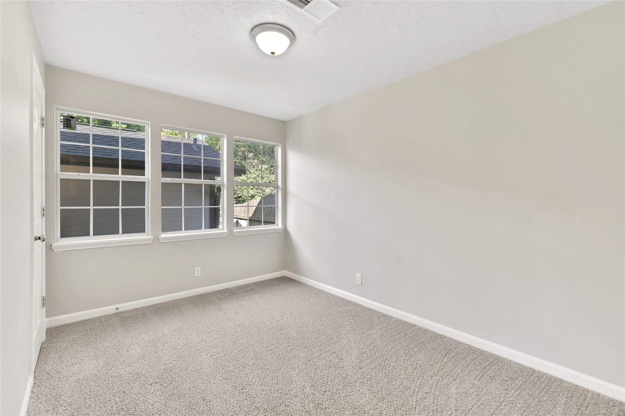 31 Montego Way Point Blank, TX 77364 - Photo 14 of 23 an empty room with windows