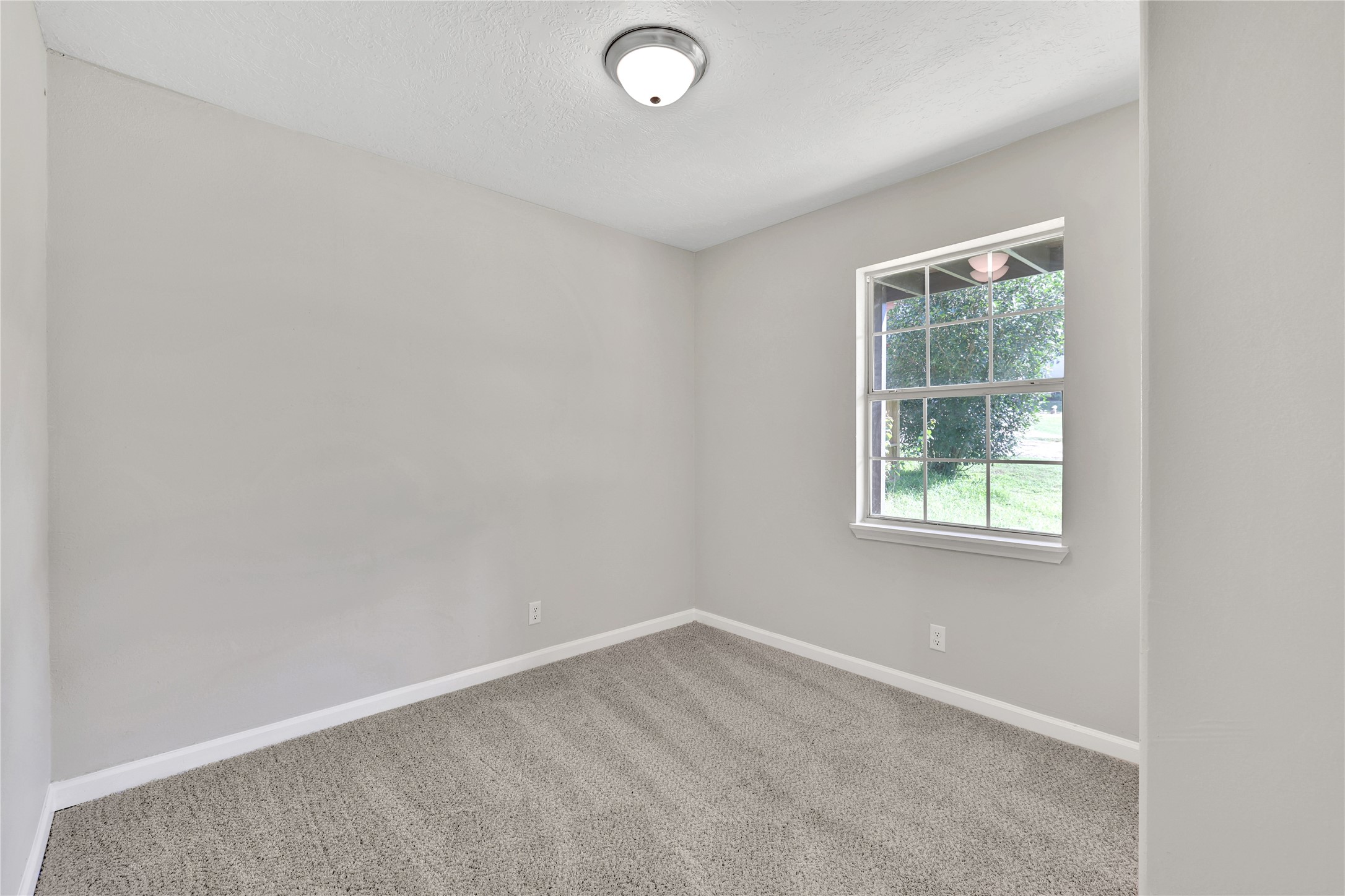 31 Montego Way Point Blank, TX 77364 - Photo 19 of 23 an empty room with a window