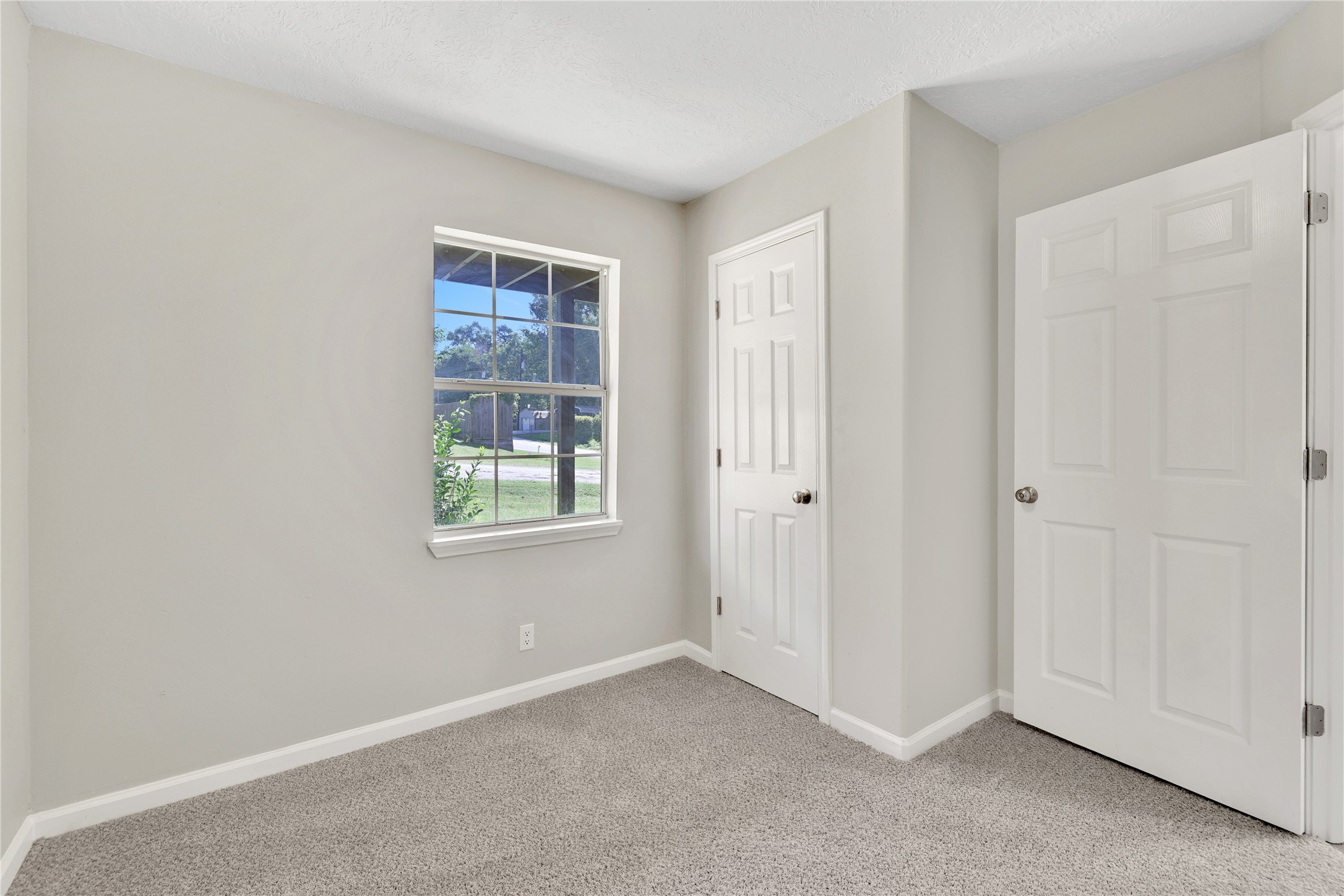 31 Montego Way Point Blank, TX 77364 - Photo 20 of 23 an empty room with windows