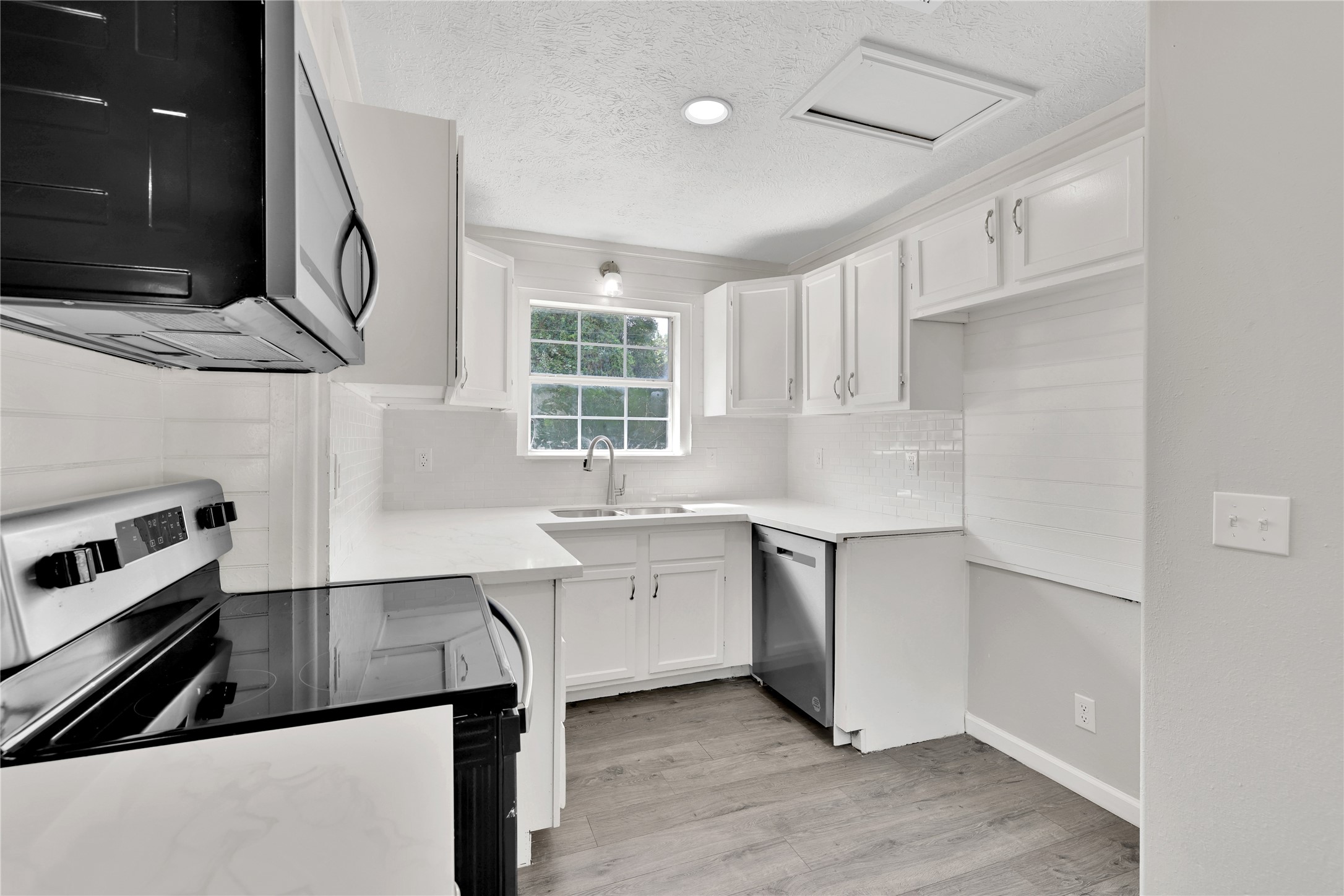 31 Montego Way Point Blank, TX 77364 - Photo 8 of 23 a kitchen with a refrigerator sink and cabinets