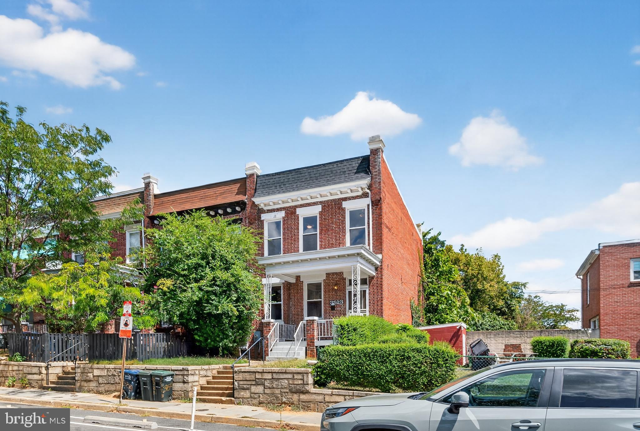 3523 Warder Street Northwest Washington, DC 20010 - Photo 1 of 30 a front view of a house with a yard