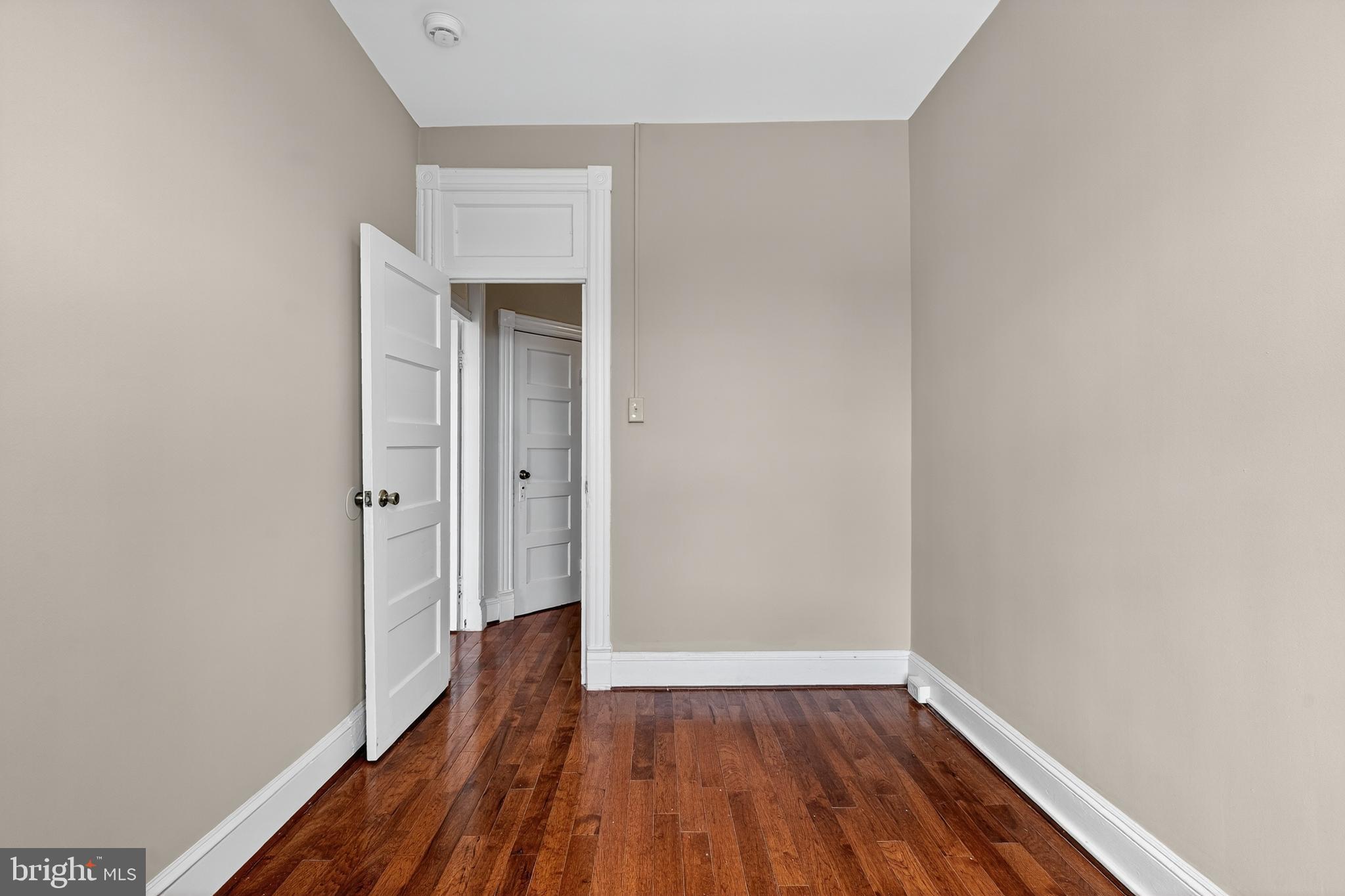 3523 Warder Street Northwest Washington, DC 20010 - Photo 18 of 30 a view of a small space with wooden floor and a window