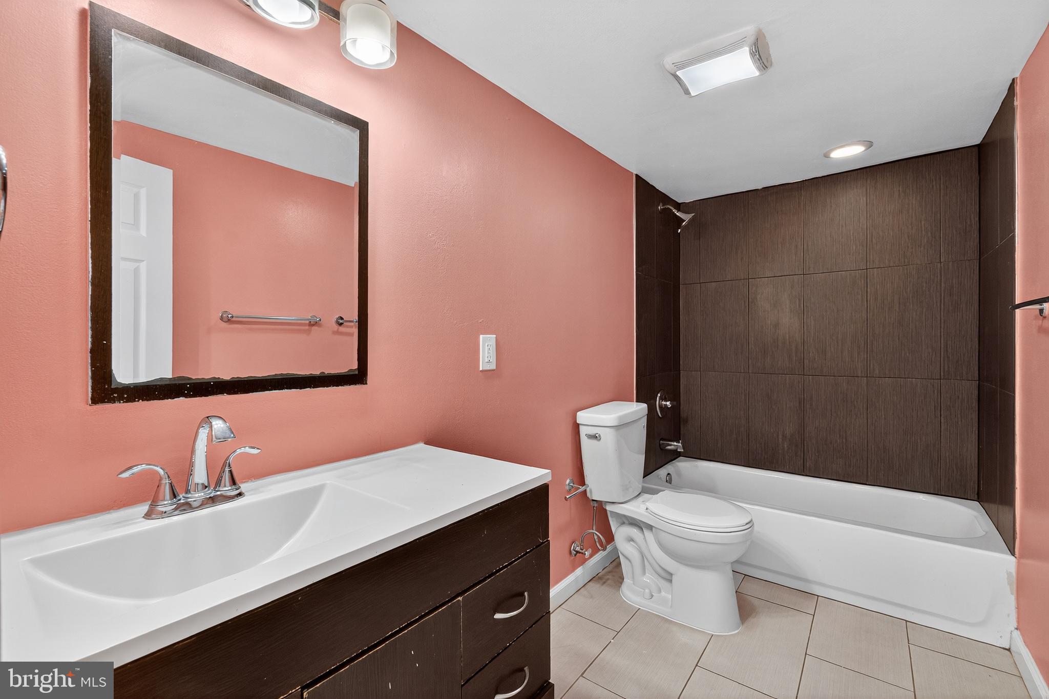 3523 Warder Street Northwest Washington, DC 20010 - Photo 23 of 30 a bathroom with a sink a toilet and shower