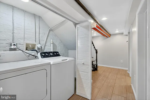 a view of a storage & utility room with washer and dryer