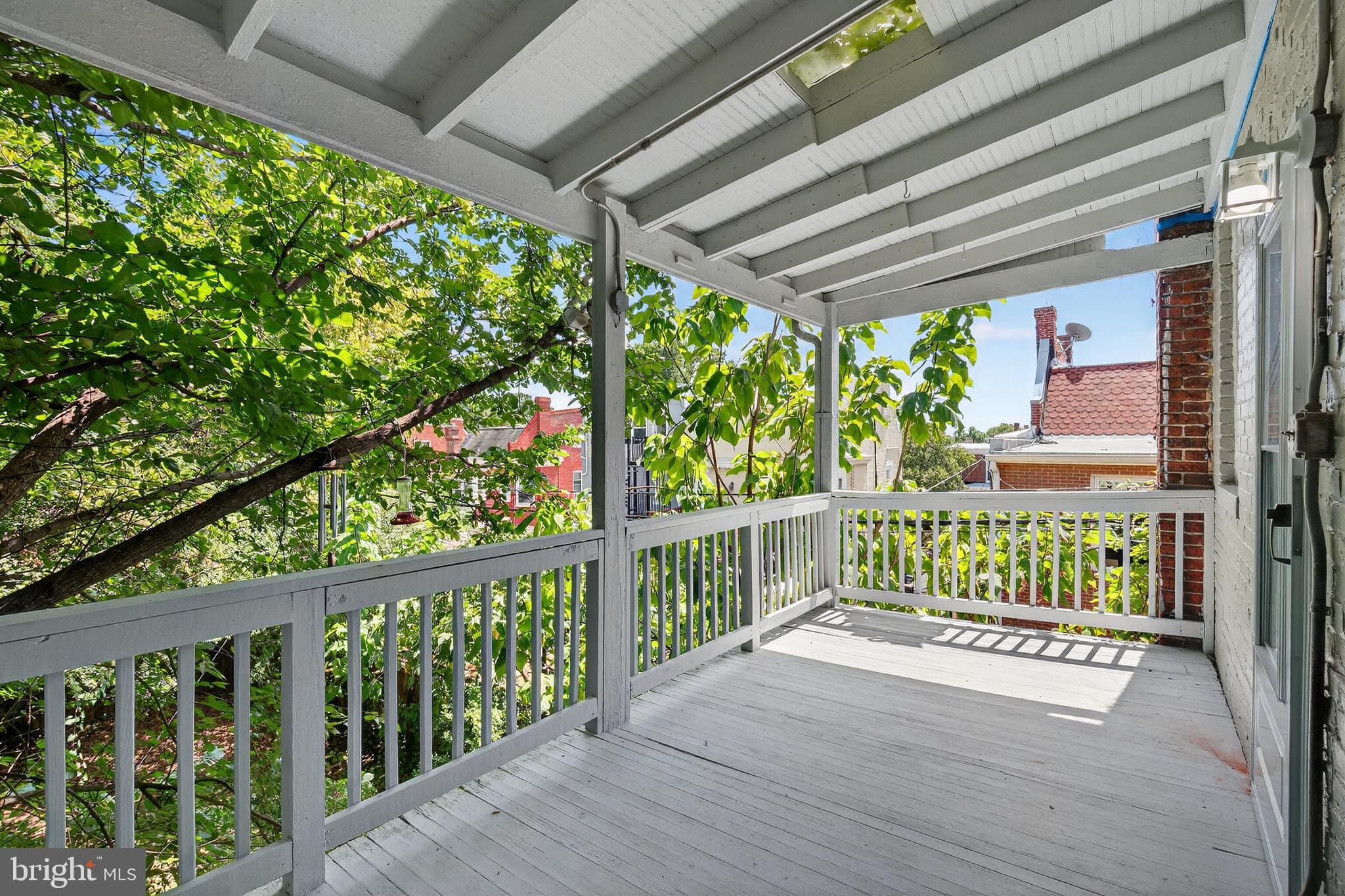 3523 Warder Street Northwest Washington, DC 20010 - Photo 10 of 30 a porch with seating space