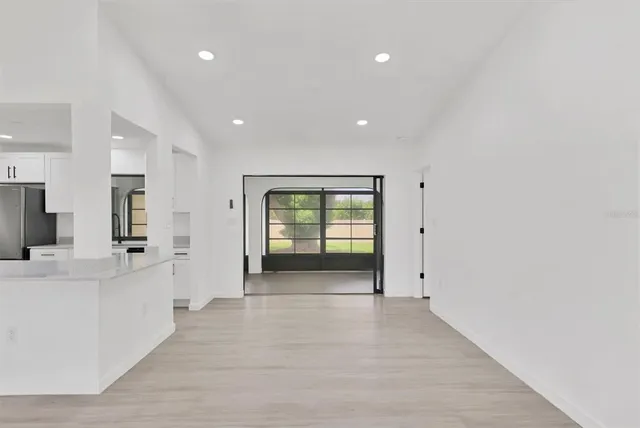 a view of an empty room with a window