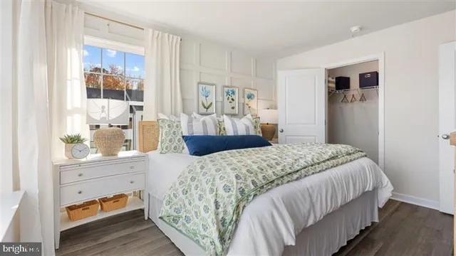 a bedroom with a large bed and a window