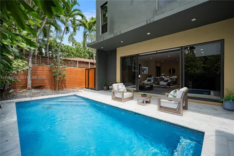 a outdoor space with patio furniture and potted plants