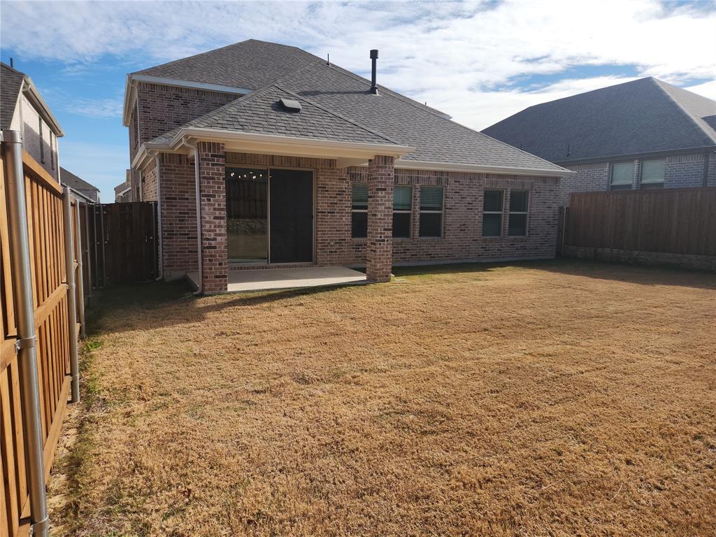 2433 Glacier Ridge Corinth, TX 76210 - Photo 21 of 40 a view of a house with a yard